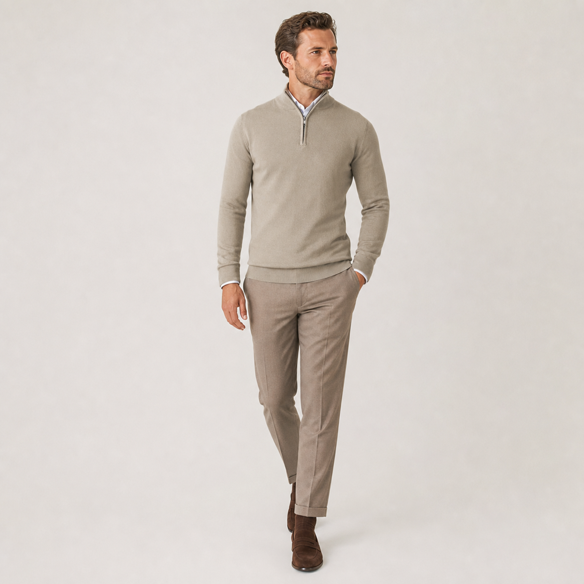 Man walking in the beige quarter-zip sweater