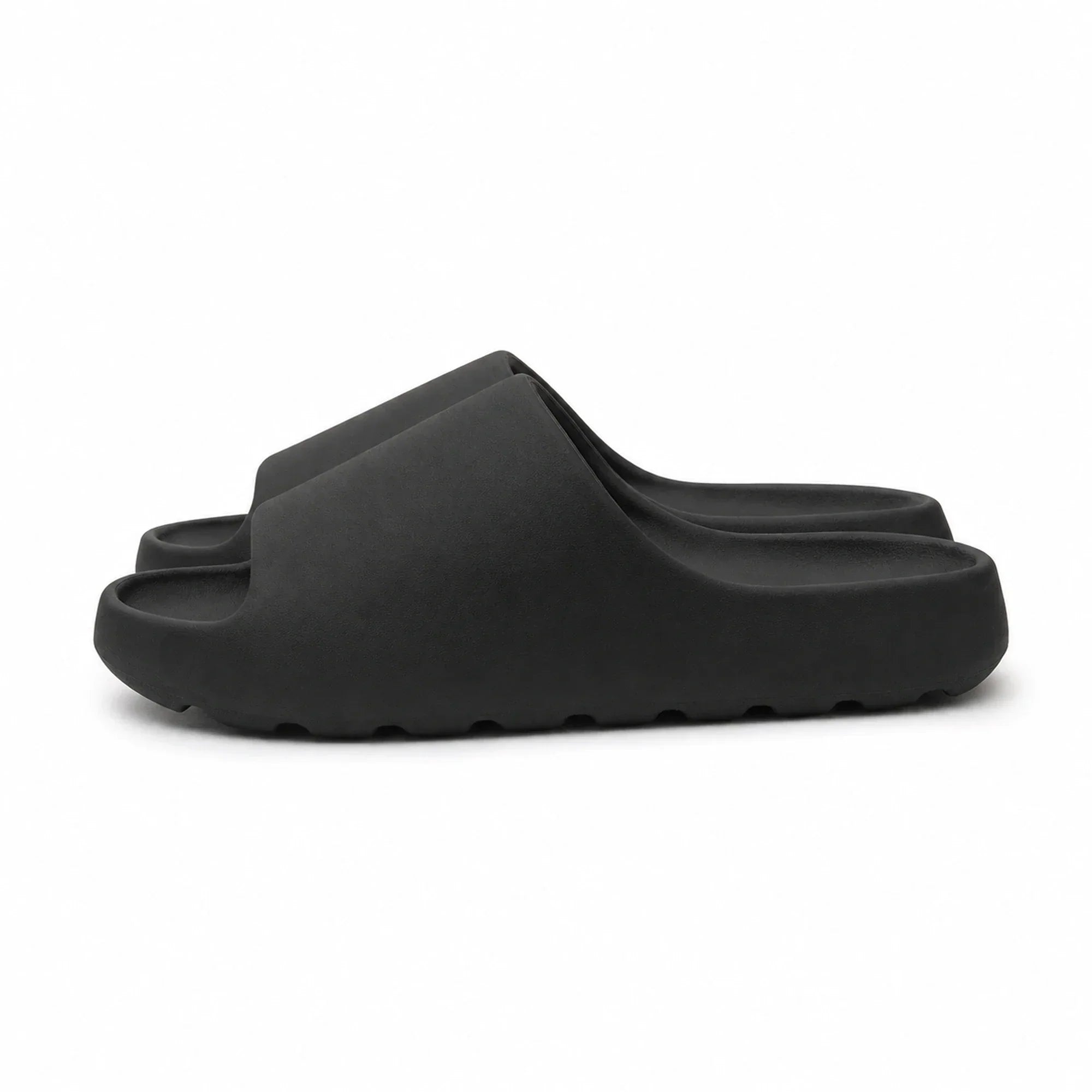 Black EVA platform slide slippers side view on white