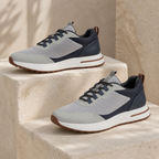 Aerivo Mist Grey sneakers — premium editorial still life