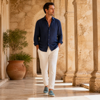 Man wearing Bellaro petrol-blue loafers in Mediterranean colonnade