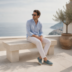 Man wearing Bellaro petrol-blue loafers on coastal terrace