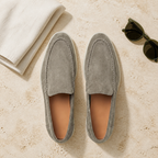 Bellaro stone-pistachio loafers in a refined travertine flat lay