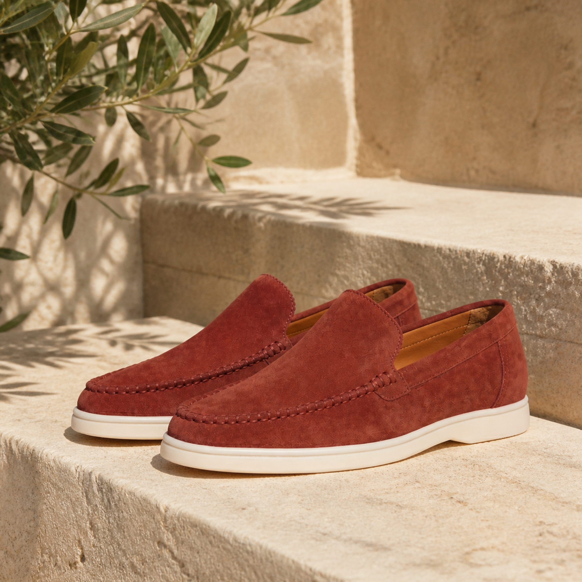Bellaro port red loafers on travertine editorial setting