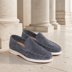 Bellaro steel-blue moc-toe loafers in a limestone colonnade