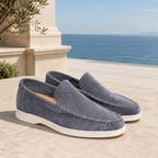 Bellaro steel-blue moc-toe loafers on a Mediterranean terrace