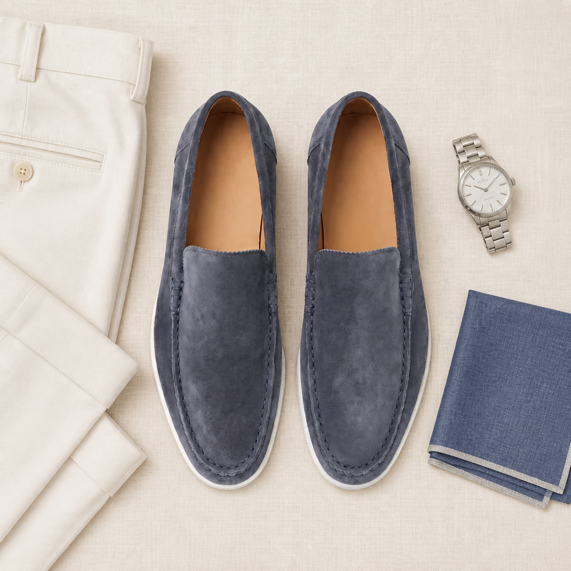 Bellaro steel-blue moc-toe loafers in a refined menswear flat lay