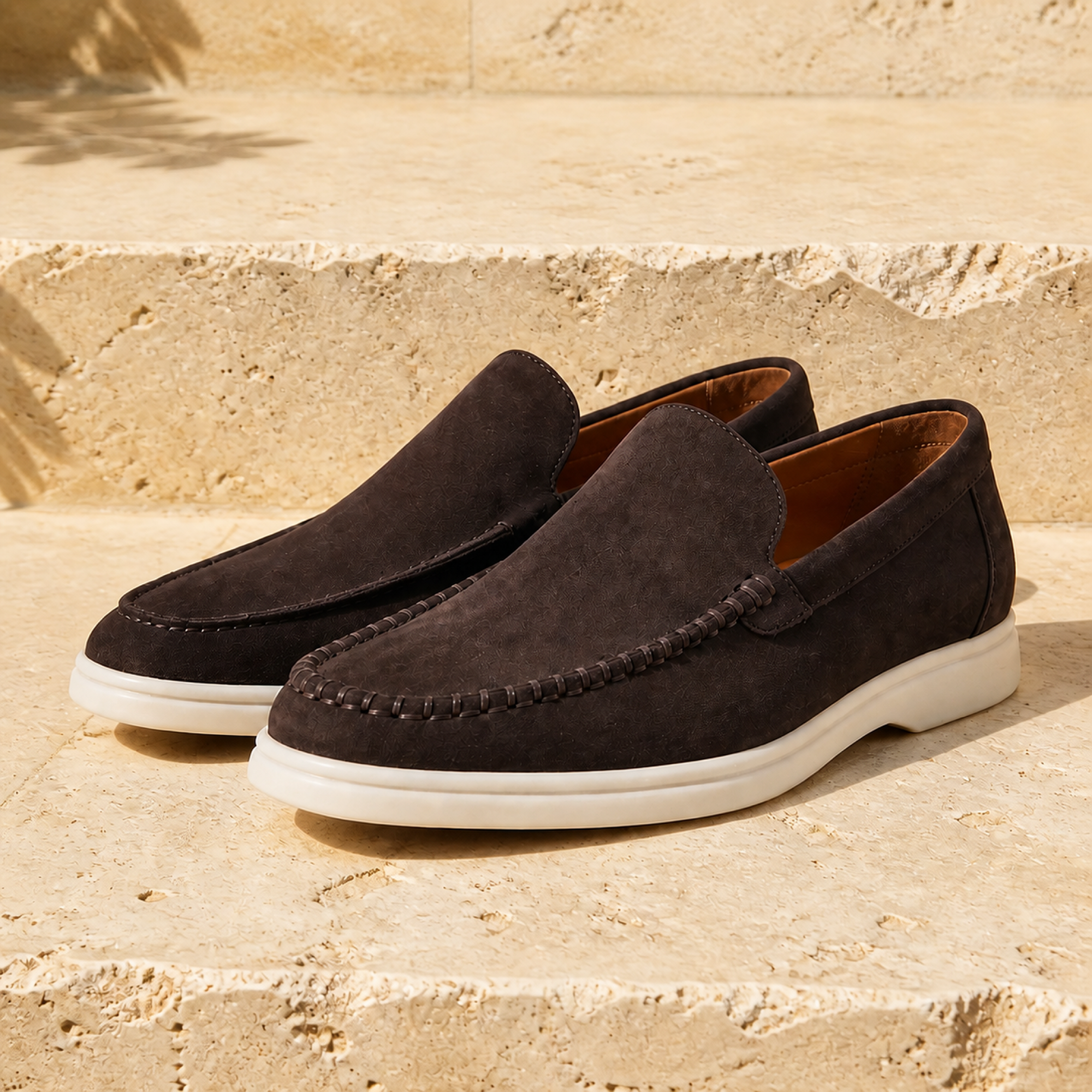 Bellaro warm grey loafers on travertine