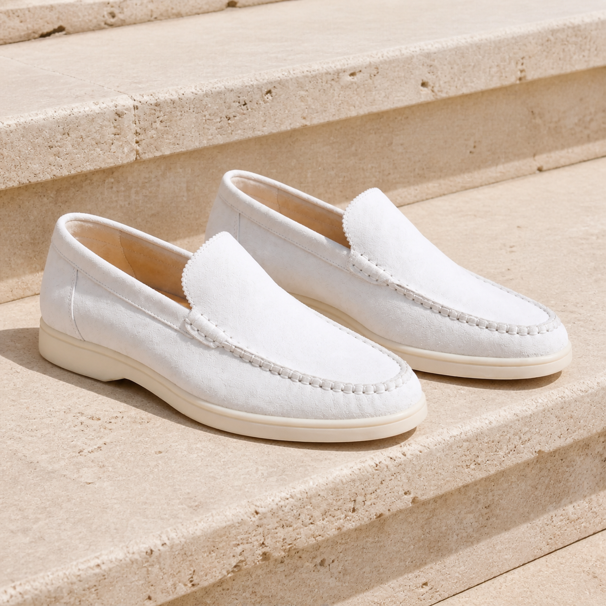 Bellaro white loafers on travertine