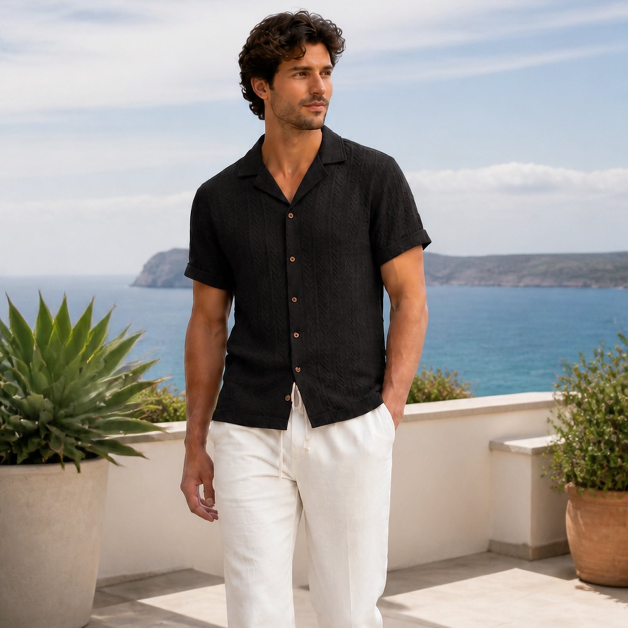 Belnor black and ivory resort set styled on a coastal rooftop