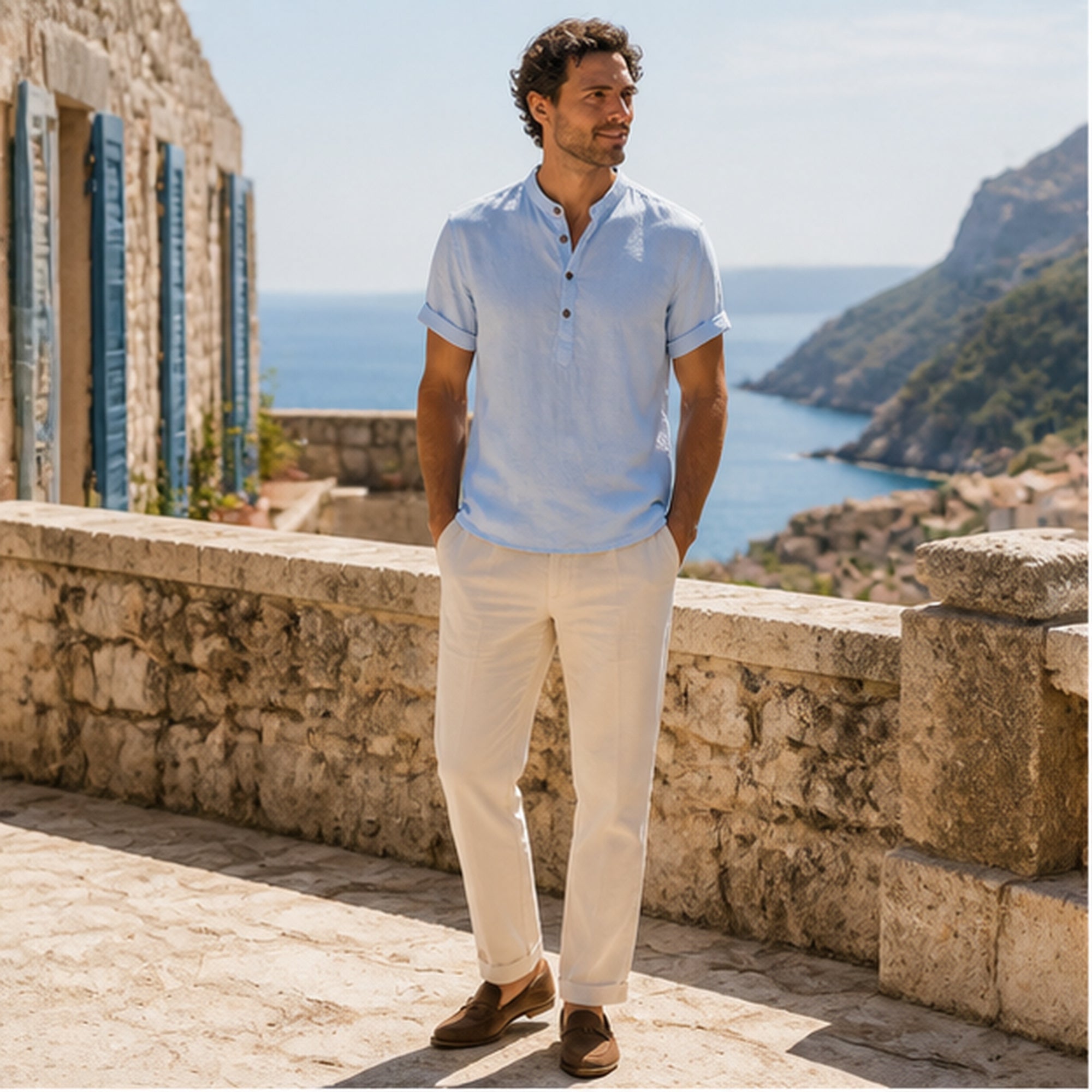 Man wearing light blue Belrino linen Henley shirt on Mediterranean terrace