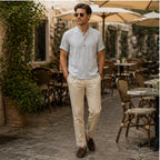 Man wearing grey Belrino linen Henley shirt at European cafe