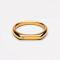 Gold ring with small round clear stone