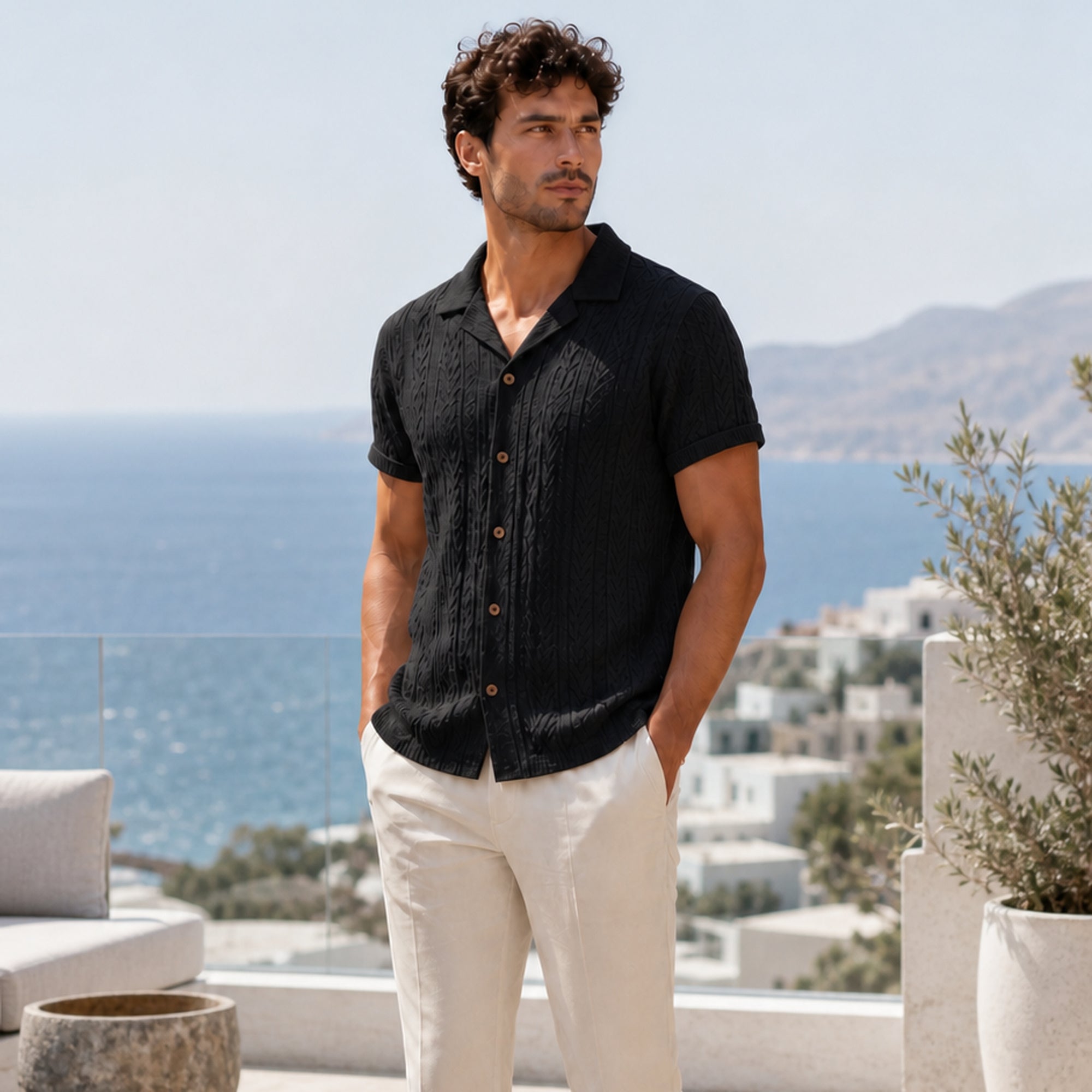 Corlian black shirt styled on a coastal rooftop