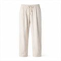 Dorevane beige relaxed cotton trousers, front studio view