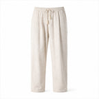 Dorevane beige relaxed cotton trousers, front studio view
