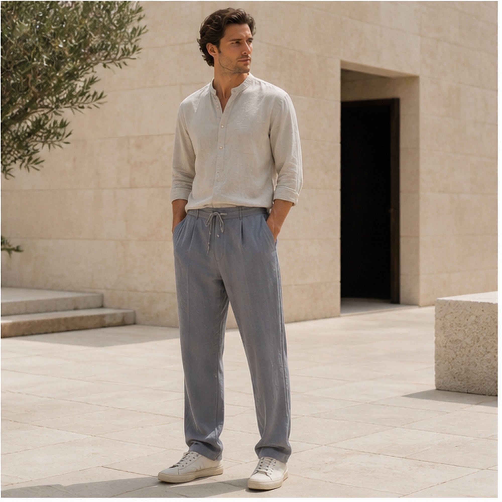 Dorevane gray trousers styled in a limestone courtyard