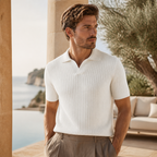Man wearing white Elvello rib-knit polo at a Mediterranean villa