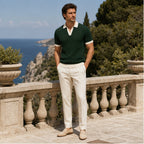 Fiorvello dark green knit polo styled on a Mediterranean terrace