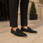 Man wearing Cormont black penny loafers with tailored trousers
