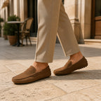 Man wearing Averino brown penny driver loafers in a European city