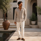 Galdane brown linen shirt styled in a Mediterranean courtyard