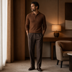 Man wearing brown Galrino polo in a warm hotel interior