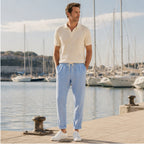 Harrino blue linen-cotton trousers beside marina