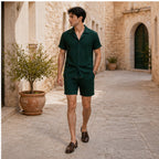 Jormont emerald resort set worn in a stone courtyard