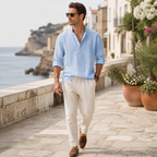 Jorrel light blue linen shirt styled on a coastal promenade
