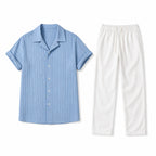 Jorvane sky-blue shirt and white trousers set, flat-lay studio view