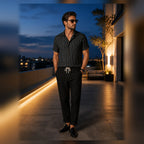 Kalemere black outfit styled on a rooftop terrace at blue hour