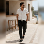 Kalemere white and black outfit styled at a coastal cafe