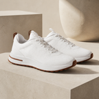 Bruce & Co Aerivo white sneakers on limestone plinths