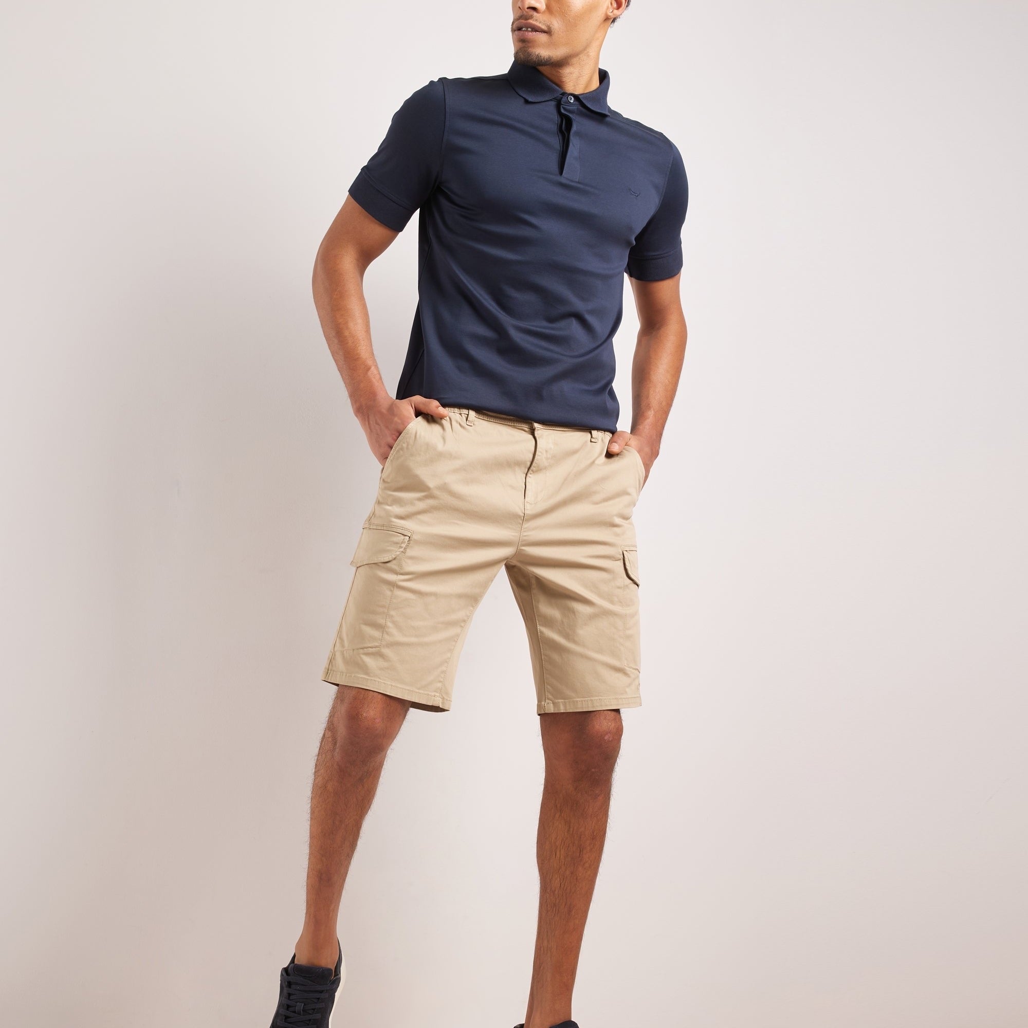 Men wearing Bruce & Co beige cargo shorts