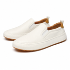 Men's white slip-on loafers, diagonal pair view