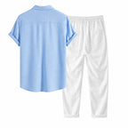 Lorvaro blue shirt and white trousers studio rear view