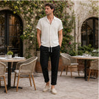 Lorvaro beige and black set in a coastal courtyard