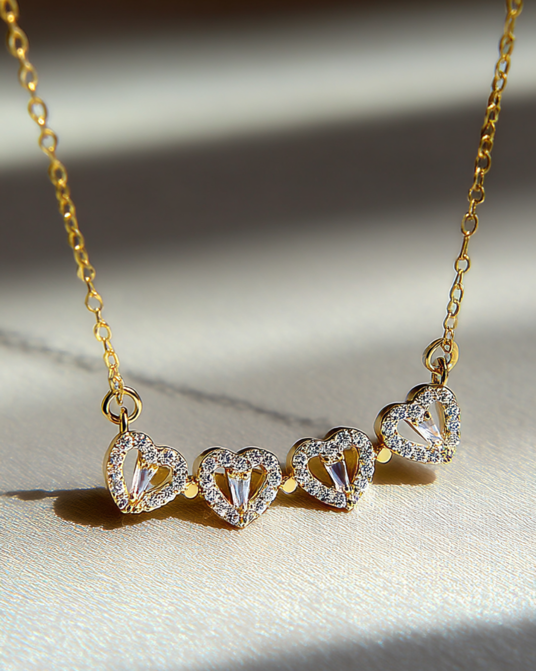 Bruce & Co Lucky Hearts – Convertible Clover and Four Hearts Necklace, Gold-Tone