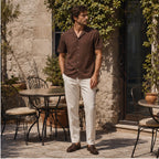 Maremora brown camp shirt in a coastal cafe courtyard