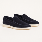Marivon navy suede apron-toe loafers, premium three-quarter studio view
