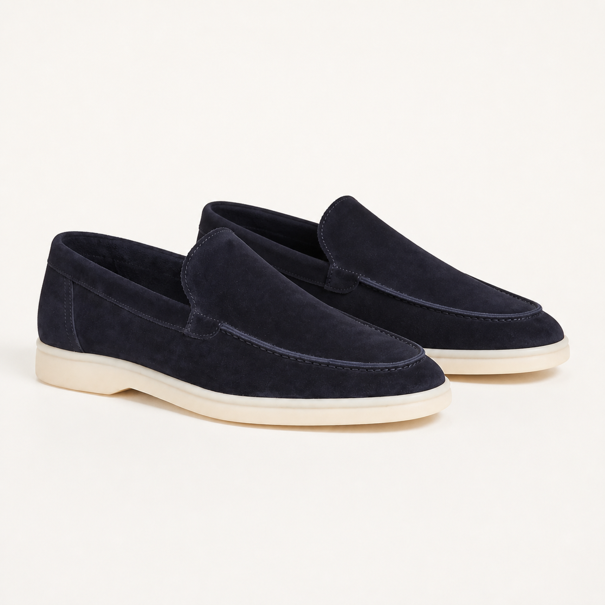 Marivon navy suede apron-toe loafers, premium three-quarter studio view