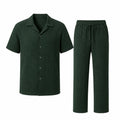 Noredane dark green shirt and drawstring trousers set on pure white background