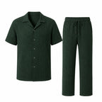 Noredane dark green shirt and drawstring trousers set on pure white background