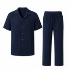Noredane navy shirt and drawstring trousers set on pure white background