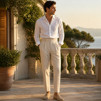 Norenor beige pleated trousers styled on a Mediterranean villa terrace