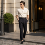 Norenor black pleated trousers styled outside a European hotel