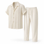 Norerino warm ivory textured shirt and drawstring trousers, angled studio view