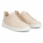 Bruce & Co Norvane beige minimalist slip-on sneakers front three-quarter view