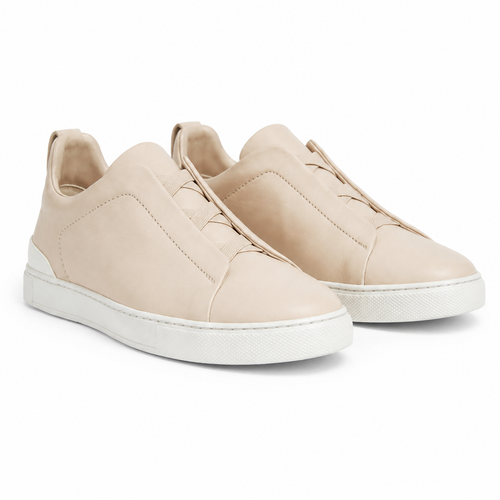Bruce & Co Norvane beige minimalist slip-on sneakers front three-quarter view