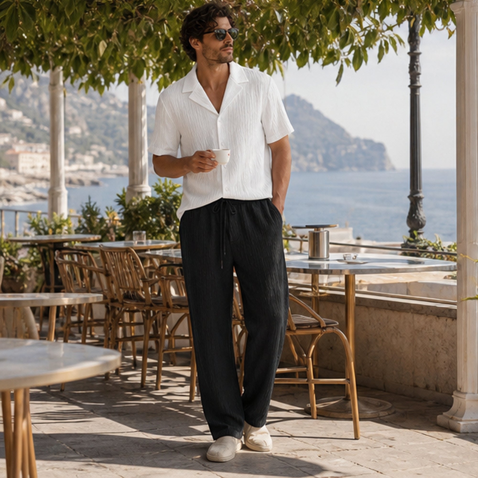 Ornor white shirt and black trousers styled in a coastal cafe